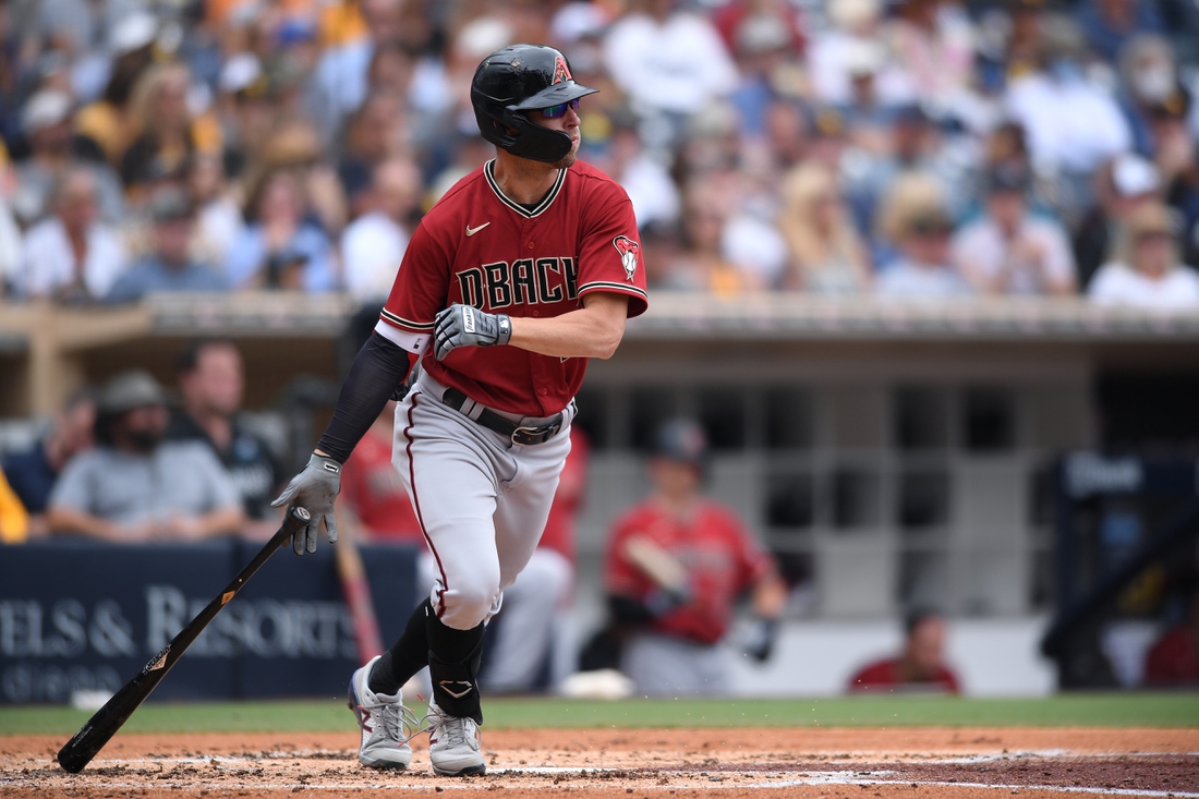 Jun 27, 2021; San Diego, California, USA; Arizona Diamondbacks right fielder Josh Reddick (22) hits a double against the San Diego Padres during the second inning at Petco Park. Mandatory Credit: Orlando Ramirez-USA TODAY Sports