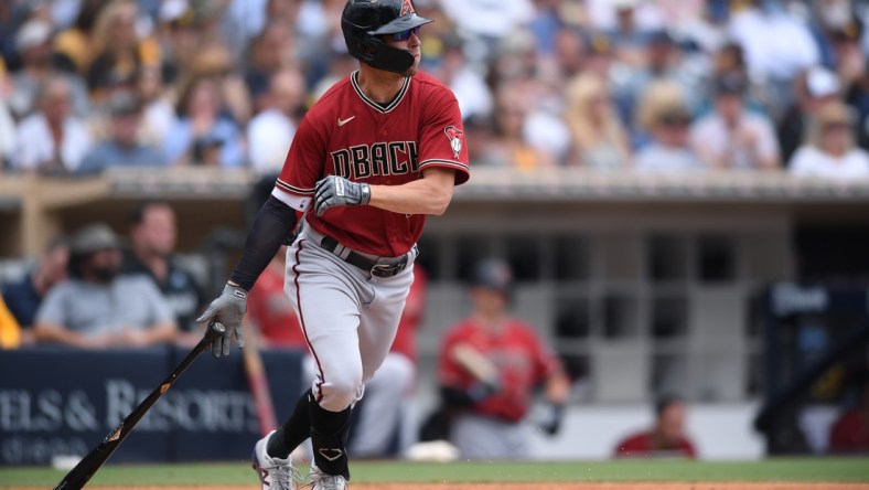 Jun 27, 2021; San Diego, California, USA; Arizona Diamondbacks right fielder Josh Reddick (22) hits a double against the San Diego Padres during the second inning at Petco Park. Mandatory Credit: Orlando Ramirez-USA TODAY Sports