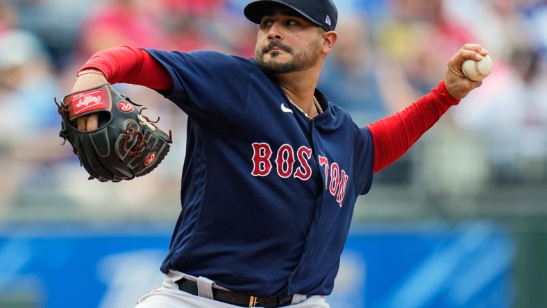 Jun 19, 2021; Kansas City, Missouri, USA; Boston Red Sox starting pitcher Martin Perez (54) pitches against the Kansas City Royals during the first inning at Kauffman Stadium. Mandatory Credit: Jay Biggerstaff-USA TODAY Sports