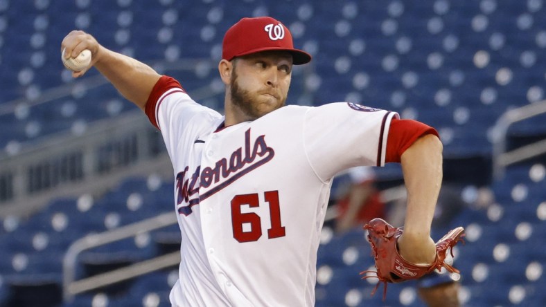 Jun 30, 2021; Washington, District of Columbia, USA; Washington Nationals relief pitcher Kyle McGowin (61) pitches against the Tampa Bay Rays in the ninth inning at Nationals Park. Mandatory Credit: Geoff Burke-USA TODAY Sports