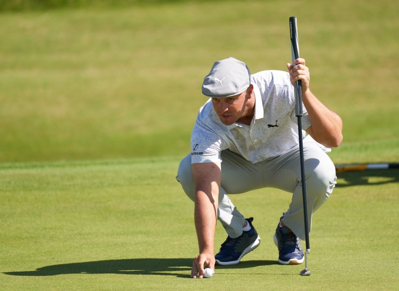 Jul 16, 2021; Sandwich, England, GB; Bryson DeChambeau lines up a putt on the sixth green during the second  round of the Open Championship golf tournament. Mandatory Credit: Peter van den Berg-USA TODAY Sports