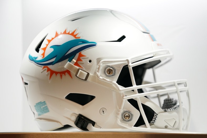 Jul 20, 2021; Miami Gardens, FL, USA; A general view of a Miami Dolphins helmet in the locker room during the grand opening at Baptist Health Training Complex. Mandatory Credit: Jasen Vinlove-USA TODAY Sports