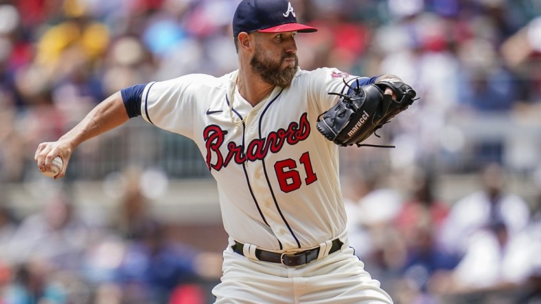 Jul 21, 2021; Cumberland, Georgia, USA; Atlanta Braves relief pitcher Shane Greene (61) throws a pitch against the San Diego Padres during the fifth inning at Truist Park. Mandatory Credit: Dale Zanine-USA TODAY Sports
