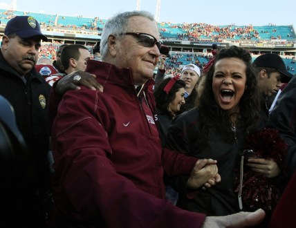 Jan. 1, 2010: A fan smiles as she congratulates FSU coach Bobby Bowden after his final game against West Virginia at Jacksonville Municipal Stadium for the Gator Bowl. [Kelly Jordan, Florida Times-Union]