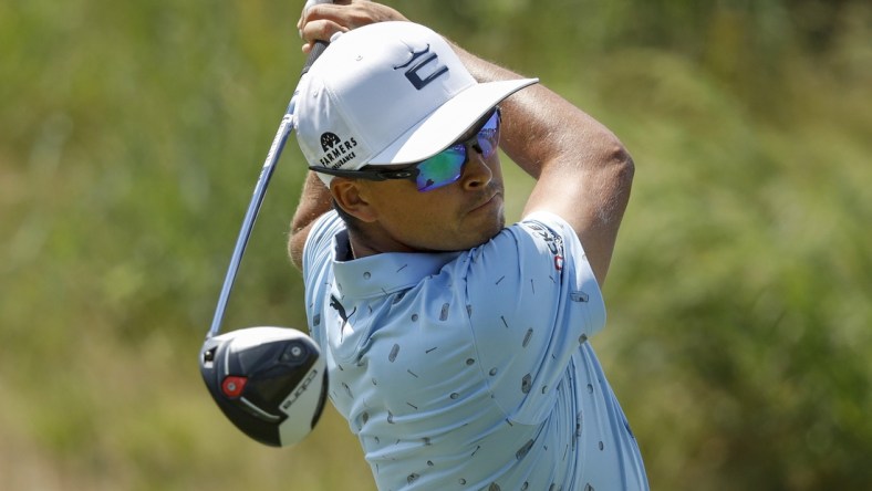 Jul 24, 2021; Blaine, Minnesota, USA; Rickie Fowler drives from the 12th tee during the third round of the 3M Open golf tournament. Mandatory Credit: Bruce Kluckhohn-USA TODAY Sports