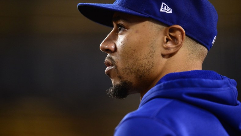 Jul 24, 2021; Los Angeles, California, USA; Los Angeles Dodgers right fielder Mookie Betts (50) watches game action against the Colorado Rockies ninth inning at Dodger Stadium. Mandatory Credit: Gary A. Vasquez-USA TODAY Sports