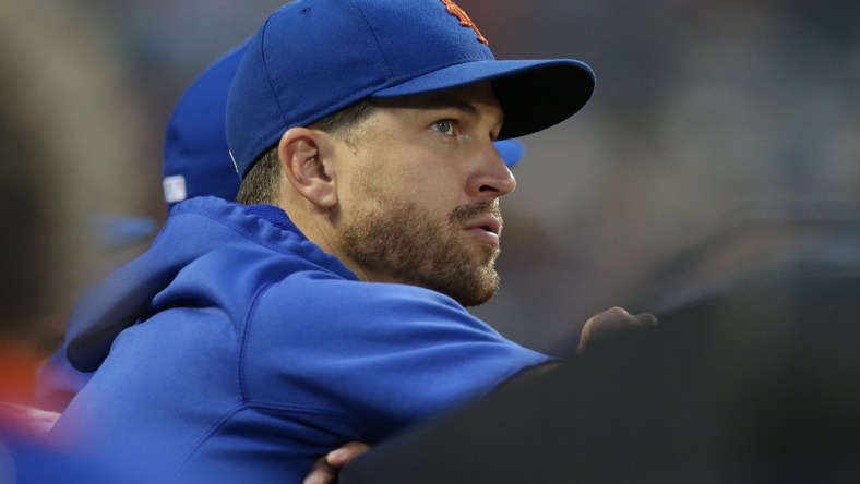 Jul 27, 2021; New York City, New York, USA; New York Mets injured starting pitcher Jacob deGrom (48) watches from the dugout during the third inning against the Atlanta Braves at Citi Field. Mandatory Credit: Brad Penner-USA TODAY Sports