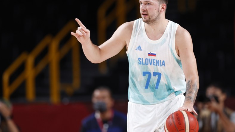 Jul 29, 2021; Saitama, Japan; Slovenia player Luka Doncic (77) dribbles while playing Japan during the Tokyo 2020 Olympic Summer Games at Saitama Super Arena. Mandatory Credit: Yukihito Taguchi-USA TODAY Sports