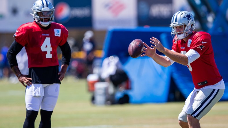 Jul 29, 2021; Oxnard, CA, USA; Dallas Cowboys quarterbacks Dak Prescott (4) and quarterback Garrett Gilbert (3) during training camp at the River Ridge playing fields at the Residence Inn by Marriott in Oxnard, California. Mandatory Credit: Jason Parkhurst-USA TODAY Sports