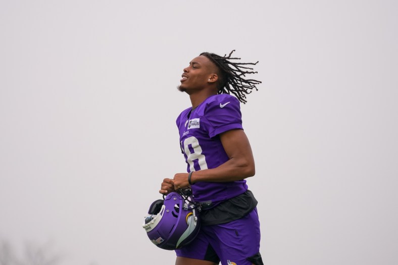 Jul 30, 2021; Eagan, MN, United States; Minnesota Vikings wide receiver Justin Jefferson (18) takes the field at training camp at TCO Performance Center. Mandatory Credit: Brad Rempel-USA TODAY Sports