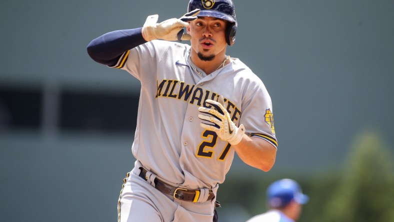 Aug 1, 2021; Atlanta, Georgia, USA; Milwaukee Brewers shortstop Willy Adames (27) celebrates after hitting a home run against the Atlanta Braves in the first inning at Truist Park. Mandatory Credit: Brett Davis-USA TODAY Sports