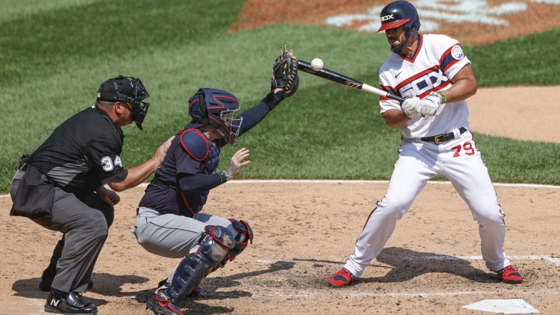 Aug 1, 2021; Chicago, Illinois, USA; Chicago White Sox first baseman Jose Abreu (79) is hit by a pitch from Cleveland Indians starting pitcher Cal Quantrill (not pictured) during the fifth inning at Guaranteed Rate Field. Mandatory Credit: Kamil Krzaczynski-USA TODAY Sports