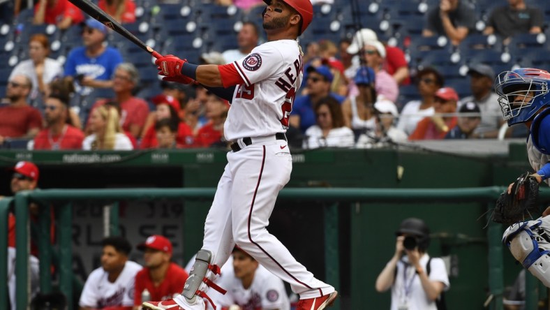 Aug 1, 2021; Washington, District of Columbia, USA; Washington Nationals left fielder Yadiel Hernandez (29) watches his walk off home run against the Chicago Cubs during the ninth inning at Nationals Park. Mandatory Credit: Brad Mills-USA TODAY Sports