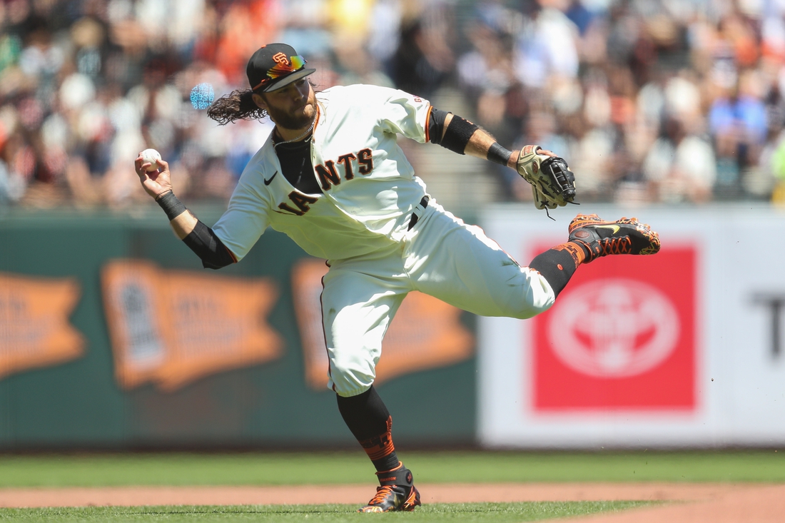 Aug 1, 2021; San Francisco, California, USA; San Francisco Giants shortstop Brandon Crawford (35) fields a ground ball during the first inning against the Houston Astros at Oracle Park. Mandatory Credit: Sergio Estrada-USA TODAY Sports