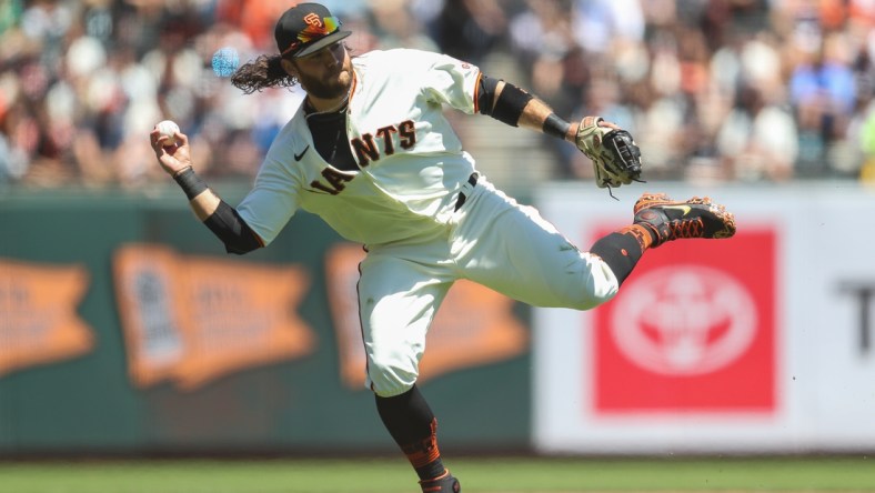 Aug 1, 2021; San Francisco, California, USA; San Francisco Giants shortstop Brandon Crawford (35) fields a ground ball during the first inning against the Houston Astros at Oracle Park. Mandatory Credit: Sergio Estrada-USA TODAY Sports