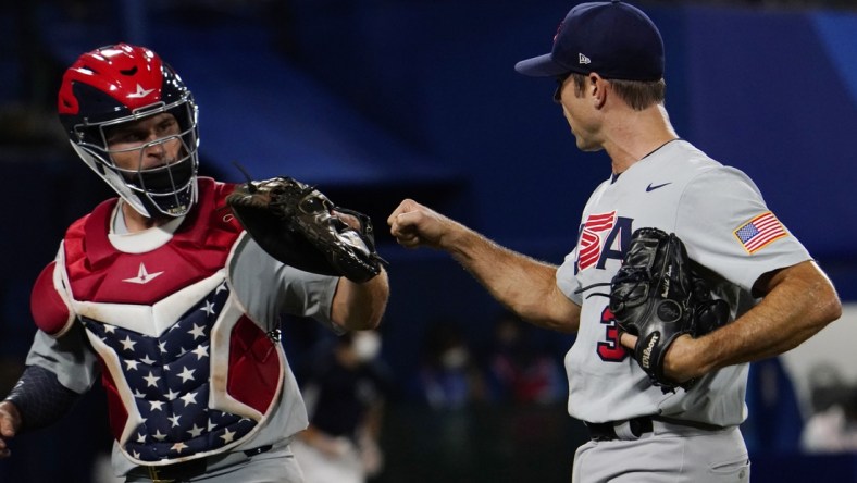 Aug 2, 2021; Yokohama, Japan; Team United States pitcher David Robertson (30) celebrates after getting out of the 8th inning against Japan in a second round baseball game during the Tokyo 2020 Olympic Summer Games at Yokohama Baseball Stadium. Mandatory Credit: Mandi Wright-USA TODAY Sports