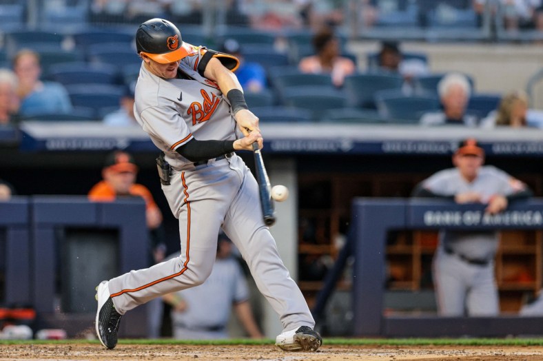 Aug 2, 2021; Bronx, New York, USA; Baltimore Orioles  right fielder Austin Hays (21) hits a home run during the third inning against the New York Yankees at Yankee Stadium. Mandatory Credit: Vincent Carchietta-USA TODAY Sports