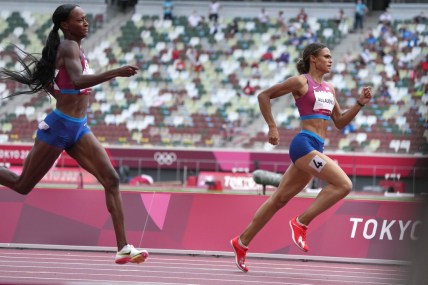 Aug 4, 2021; Tokyo, Japan; Sydney McLaughlin (USA), right, defeats Dalilah Muhammad (USA) to win the women's 400m hurdles n a world record 51.46 to 51.58 during the Tokyo 2020 Olympic Summer Games at Olympic Stadium. Mandatory Credit: Kirby Lee-USA TODAY Sports