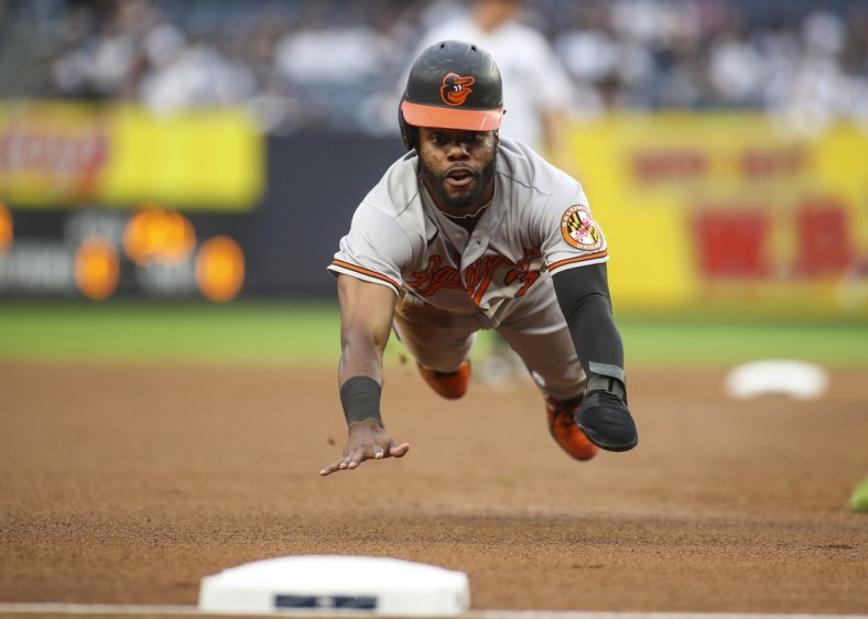 Aug 4, 2021; Bronx, New York, USA; Baltimore Orioles center fielder Cedric Mullins (31) slides into third base in the first inning against the New York Yankees at Yankee Stadium. Mandatory Credit: Wendell Cruz-USA TODAY Sports