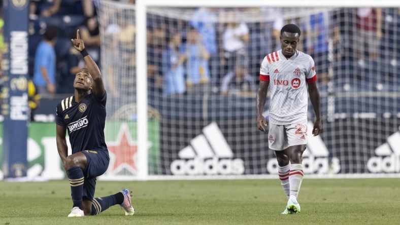 Aug 4, 2021; Chester, Pennsylvania, USA; Philadelphia Union forward Sergio Santos (17) reacts after scoring a goal as Toronto FC midfielder Richie Laryea (22) looks on in the first half at Subaru Park. Mandatory Credit: Mitchell Leff-USA TODAY Sports