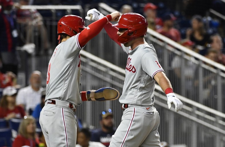 Aug 4, 2021; Washington, District of Columbia, USA; Philadelphia Phillies first baseman Rhys Hoskins (right) is congratulated by right fielder Bryce Harper (left) after hitting a two-run home run against the Washington Nationals during the fifth inning at Nationals Park. Mandatory Credit: Brad Mills-USA TODAY Sports