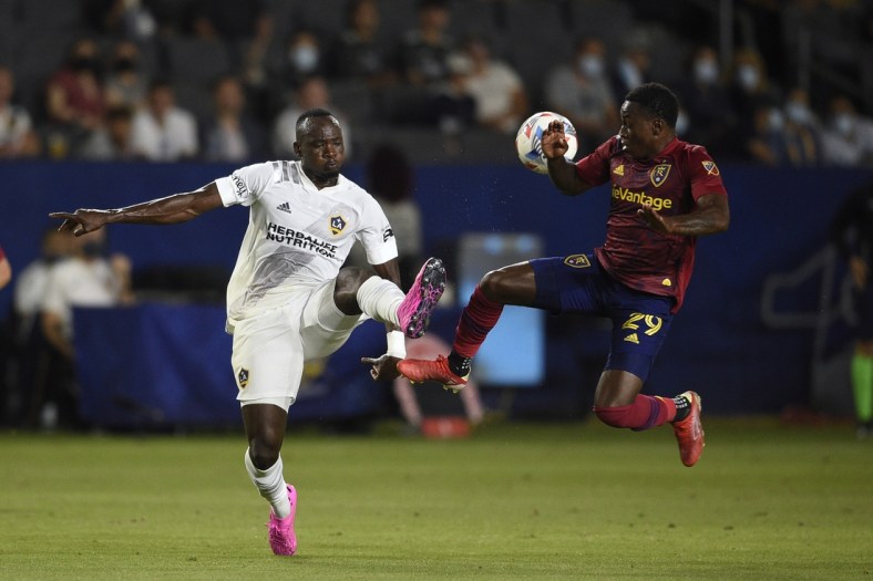 Aug 4, 2021; Carson, California, USA; LA Galaxy defender S  ga Coulibaly (4) and Real Salt Lake forward Anderson Julio (29) battle for the ball during the first half at StubHub Center. Mandatory Credit: Kelvin Kuo-USA TODAY Sports