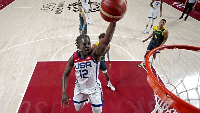 Aug 5, 2021; Saitama, Japan; United States guard Jrue Holiday (12) dunks the ball against Australia in the men's basketball semi final during the Tokyo 2020 Olympic Summer Games at Saitama Super Arena. Mandatory Credit: Kyle Terada-USA TODAY Sports