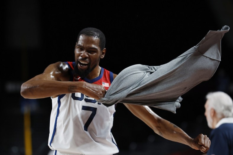 Aug 5, 2021; Saitama, Japan; United States forward Kevin Durant (7) celebrates on the bench against Australia in the third quarter during the Tokyo 2020 Olympic Summer Games at Saitama Super Arena. Mandatory Credit: Geoff Burke-USA TODAY Sports