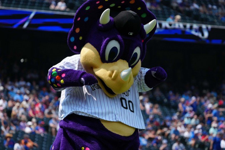 Aug 5, 2021; Denver, Colorado, USA; Colorado Rockies mascot Dinger performs before a game against the Chicago Cubs at Coors Field. Mandatory Credit: Ron Chenoy-USA TODAY Sports