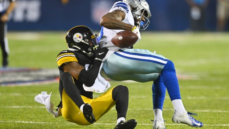 Aug 5, 2021; Canton, Ohio, USA; Pittsburgh Steelers cornerback Mark Gilbert (17) tackles Dallas Cowboys wide receiver Brandon Smith (80) during the second half at Tom Benson Hall of Fame Stadium. Mandatory Credit: Ken Blaze-USA TODAY Sports