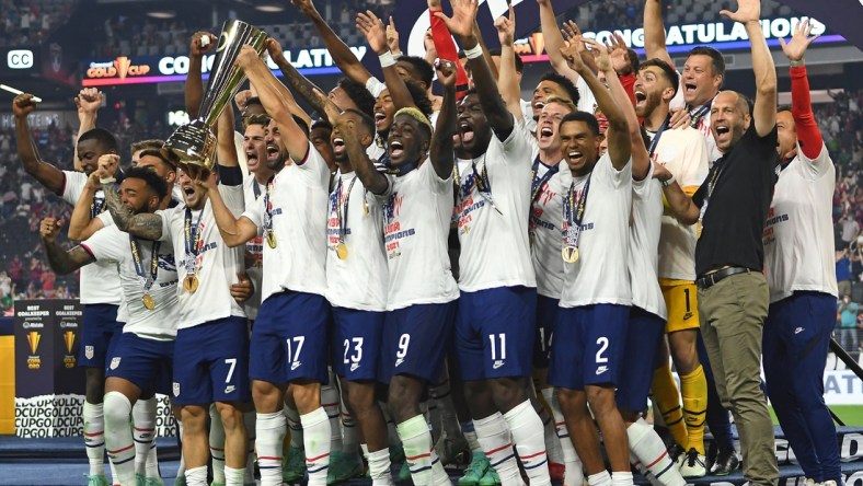 Aug 1, 2021; Las Vegas, Nevada, USA; USA players celebrate after defeating Mexico 1-0 in extra time to win the CONCACAF Gold Cup final soccer match at Allegiant Stadium. Mandatory Credit: Stephen R. Sylvanie-USA TODAY Sports