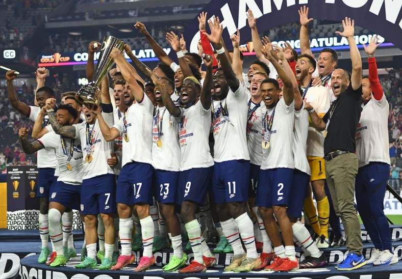 Aug 1, 2021; Las Vegas, Nevada, USA; USA players celebrate after defeating Mexico 1-0 in extra time to win the CONCACAF Gold Cup final soccer match at Allegiant Stadium. Mandatory Credit: Stephen R. Sylvanie-USA TODAY Sports