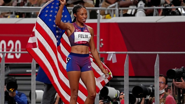 Aug 6, 2021; Tokyo, Japan; Allyson Felix (USA) celebrates winning the bronze medal in the women's 400m final during the Tokyo 2020 Olympic Summer Games at Olympic Stadium. Mandatory Credit: Kirby Lee-USA TODAY Sports