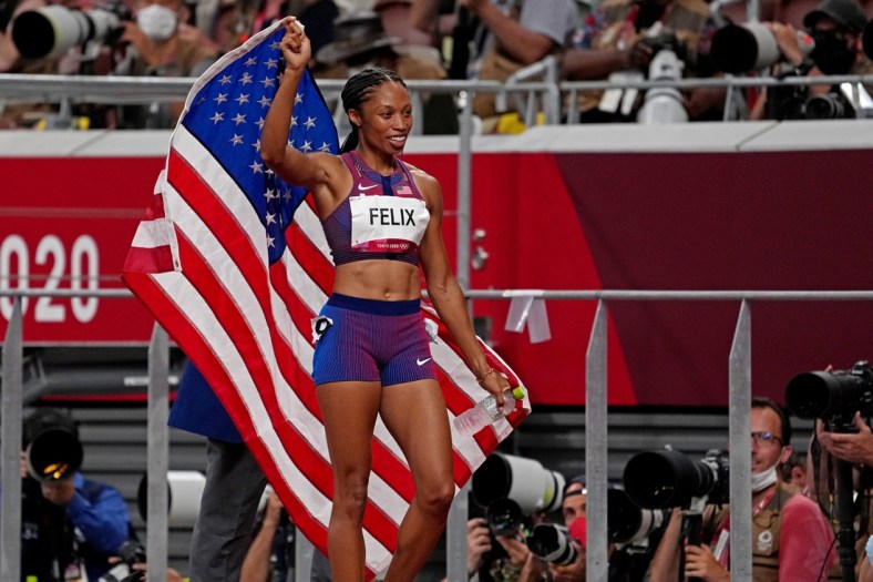 Aug 6, 2021; Tokyo, Japan; Allyson Felix (USA) celebrates winning the bronze medal in the women's 400m final during the Tokyo 2020 Olympic Summer Games at Olympic Stadium. Mandatory Credit: Kirby Lee-USA TODAY Sports