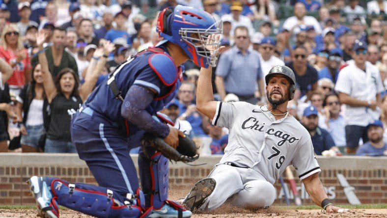 Aug 6, 2021; Chicago, Illinois, USA; Chicago White Sox first baseman Jose Abreu (79) scores against the Chicago Cubs during the fourth inning at Wrigley Field. Mandatory Credit: Kamil Krzaczynski-USA TODAY Sports