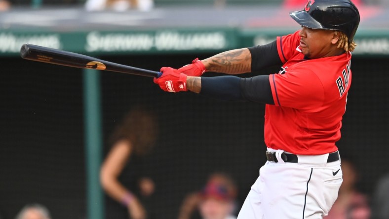 Aug 6, 2021; Cleveland, Ohio, USA; Cleveland Indians designated hitter Jose Ramirez (11) hits a double during the third inning against the Detroit Tigers at Progressive Field. Mandatory Credit: Ken Blaze-USA TODAY Sports