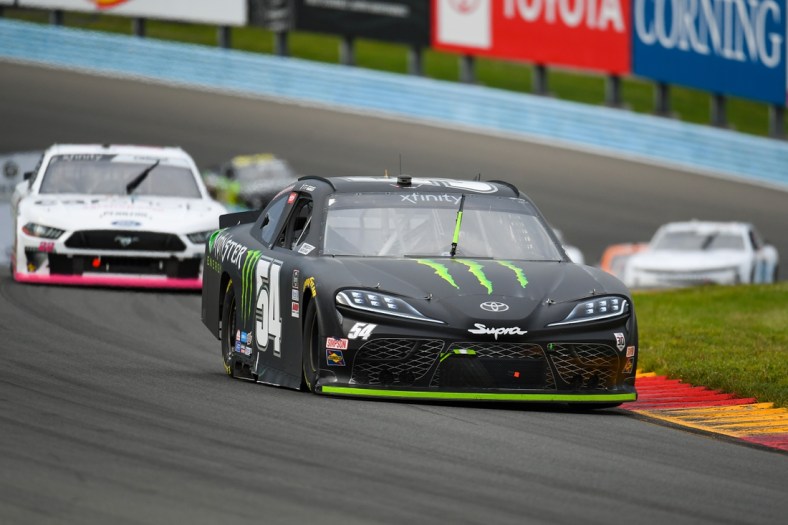 Aug 7, 2021; Watkins Glen, NY, USA; NASCAR Xfinity Series driver Ty Gibbs (54) leads a group of cars during the Skrewball Peanut Butter Whiskey 200 at Watkins Glen International. Mandatory Credit: Rich Barnes-USA TODAY Sports
