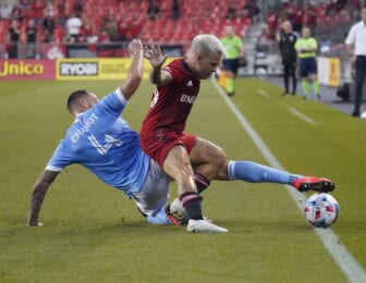 Aug 7, 2021; Toronto, Ontario, CAN; New York City FC defender Maxime Chanot (4) and Toronto FC midfielder Yeferson Soteldo (30) battle for the ball during the first half at BMO Field. Mandatory Credit: John E. Sokolowski-USA TODAY Sports