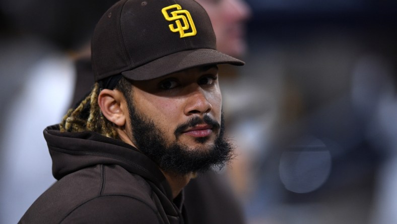 Aug 7, 2021; San Diego, California, USA; San Diego Padres shortstop Fernando Tatis Jr. (23) looks on from the dugout during the eighth inning against the Arizona Diamondbacks at Petco Park. Mandatory Credit: Orlando Ramirez-USA TODAY Sports