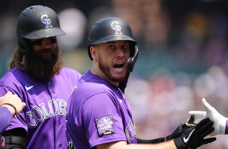 Aug 8, 2021; Denver, Colorado, USA; Colorado Rockies first baseman C.J. Cron (25) celebrates his three run home run in the first inning against the Miami Marlins at Coors Field. Mandatory Credit: Ron Chenoy-USA TODAY Sports