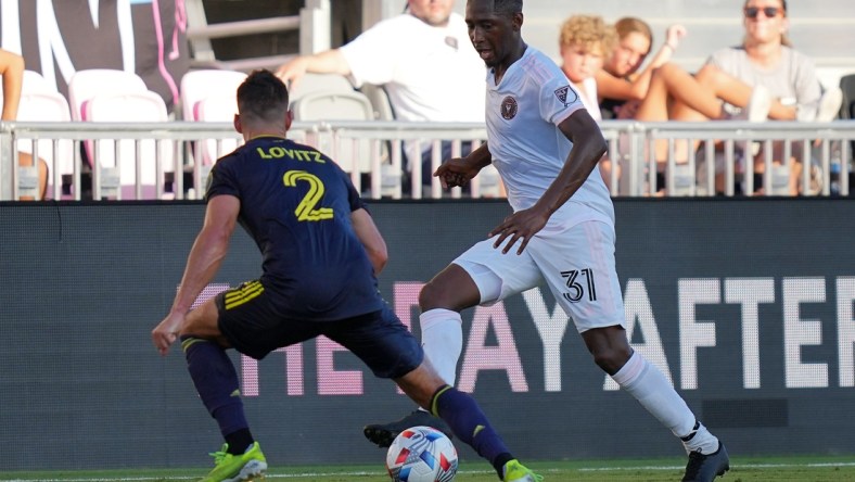 Aug 8, 2021; Fort Lauderdale, FL, USA; Inter Miami CF defender Kelvin Leerdam (31) dribbles the ball around Nashville SC defender Daniel Lovitz (2) during the first half at DRV PNK Stadium. Mandatory Credit: Jasen Vinlove-USA TODAY Sports