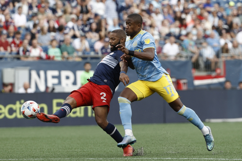 Aug 8, 2021; Foxborough, Massachusetts, USA; New England Revolution defender Andrew Farrell (2) clears the ball away from Philadelphia Union forward Sergio Santos (17) during the first half at Gillette Stadium. Mandatory Credit: Winslow Townson-USA TODAY Sports