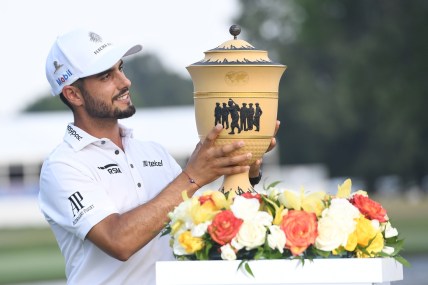 Aug 8, 2021; Memphis, Tennessee, USA, Abraham Ancer poses with the Gary Player Cup after winning WGC FedEx St. Jude Invitational golf tournament at TPC Southwind in a two hole playoff. Mandatory Credit: Christopher Hanewinckel-USA TODAY Sports
