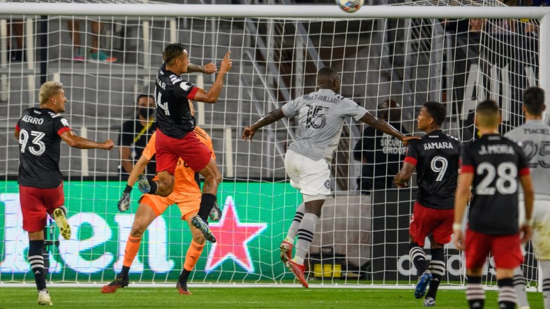 Aug 8, 2021; Washington, DC, Washington, DC, USA;  D.C. United midfielder Andy Najar (14) heads the ball into the net for a goal against the CF Montr al during the first half at Audi Field. Mandatory Credit: Rafael Suanes-USA TODAY Sports