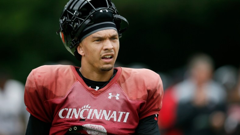 Cincinnati Bearcats quarterback Desmond Ridder (9) resets between plays during practice at the Higher Ground training facility in West Harrison, Ind., on Monday, Aug. 9, 2021.

Cincinnati Bearcats Football Camp