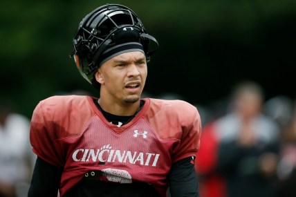 Cincinnati Bearcats quarterback Desmond Ridder (9) resets between plays during practice at the Higher Ground training facility in West Harrison, Ind., on Monday, Aug. 9, 2021.

Cincinnati Bearcats Football Camp