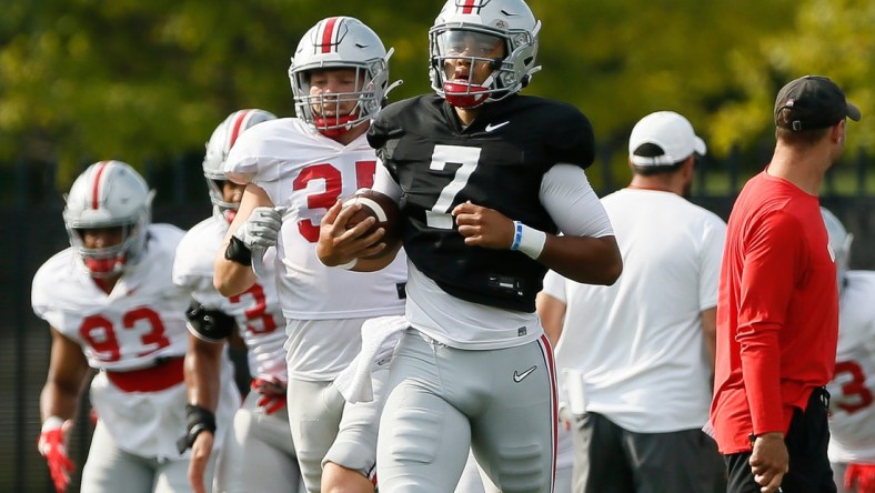 Ohio State Buckeyes quarterback C.J. Stroud (7) jogs during warm-ups for football training camp at the Woody Hayes Athletic Center in Columbus on Tuesday, Aug. 10, 2021.

Ohio State Football Training Camp