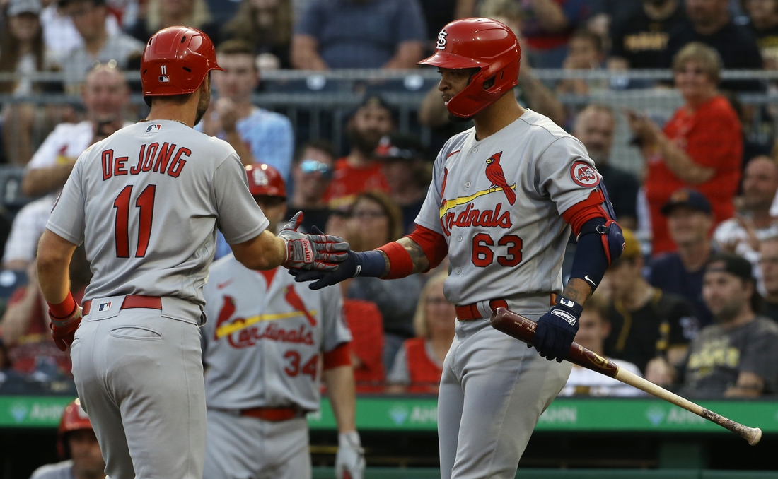 Aug 10, 2021; Pittsburgh, Pennsylvania, USA;  St. Louis Cardinals shortstop Paul DeJong (11) celebrates with second baseman Edmundo Sosa (63) after hitting a a solo home run against the Pittsburgh Pirates during the second inning at PNC Park. Mandatory Credit: Charles LeClaire-USA TODAY Sports