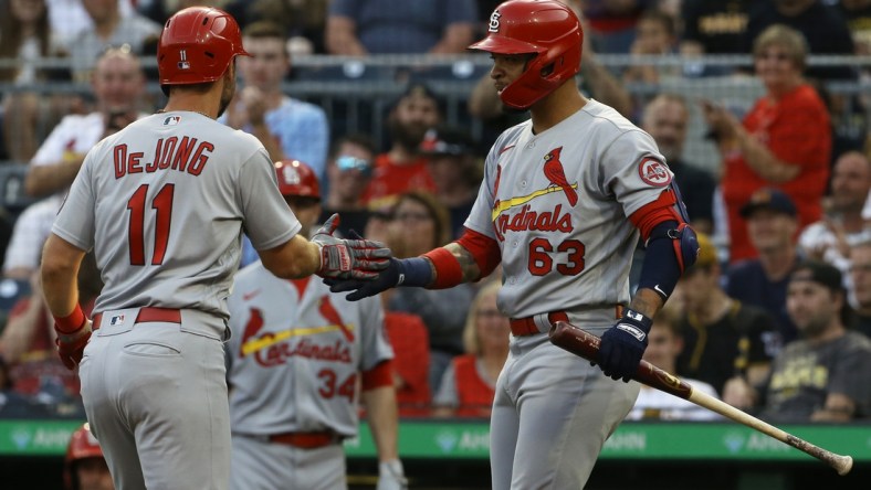 Aug 10, 2021; Pittsburgh, Pennsylvania, USA;  St. Louis Cardinals shortstop Paul DeJong (11) celebrates with second baseman Edmundo Sosa (63) after hitting a a solo home run against the Pittsburgh Pirates during the second inning at PNC Park. Mandatory Credit: Charles LeClaire-USA TODAY Sports