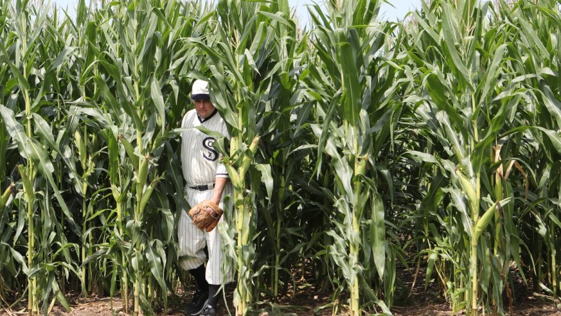 Aug 12, 2021; Dyersville, Iowa, USA; John Sutter of Dubuque, Iowa, exits the cornstalk at the original movie site before the game between the Chicago White Sox and the New York Yankees at the Field of Dreams. John has been a member of the  ghost players  team for over 10 years.   Mandatory Credit: Reese Strickland-USA TODAY Sports